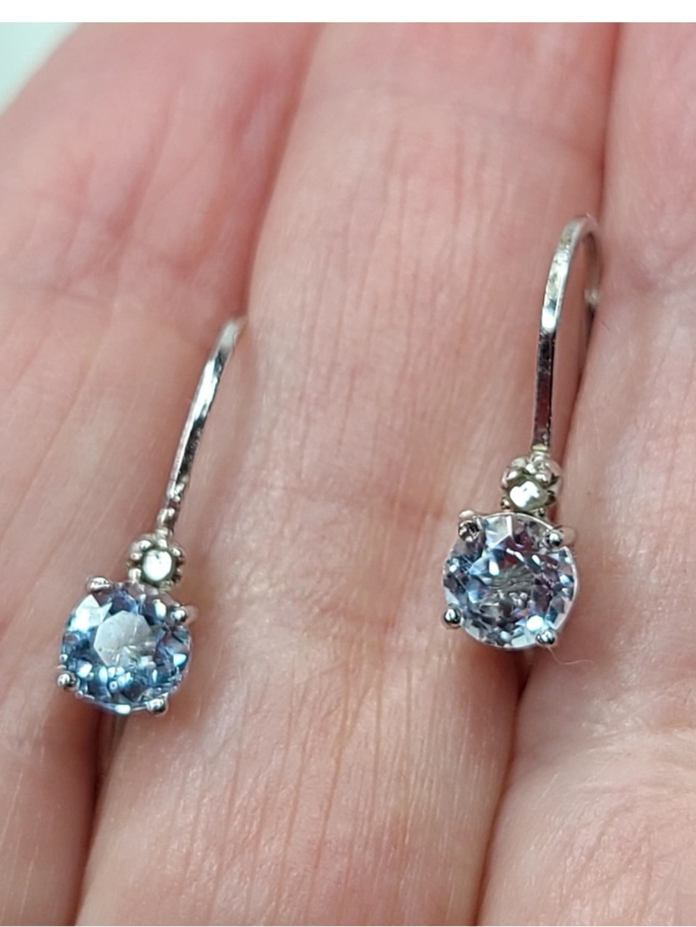 Sterling silver aquamarine and diamond accent drop earrings.